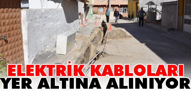 ELEKTRİK KABLOLARI YER ALTINA ALINIYOR